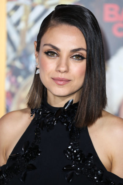 Mila Kunis wearing a Cushnie et Ochs dress and Christian Louboutin shoes arrives at the Los Angeles Premiere Of STX Entertainment's 'A Bad Moms Christmas'