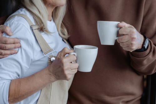 Pexels - Couple holding coffee mugs